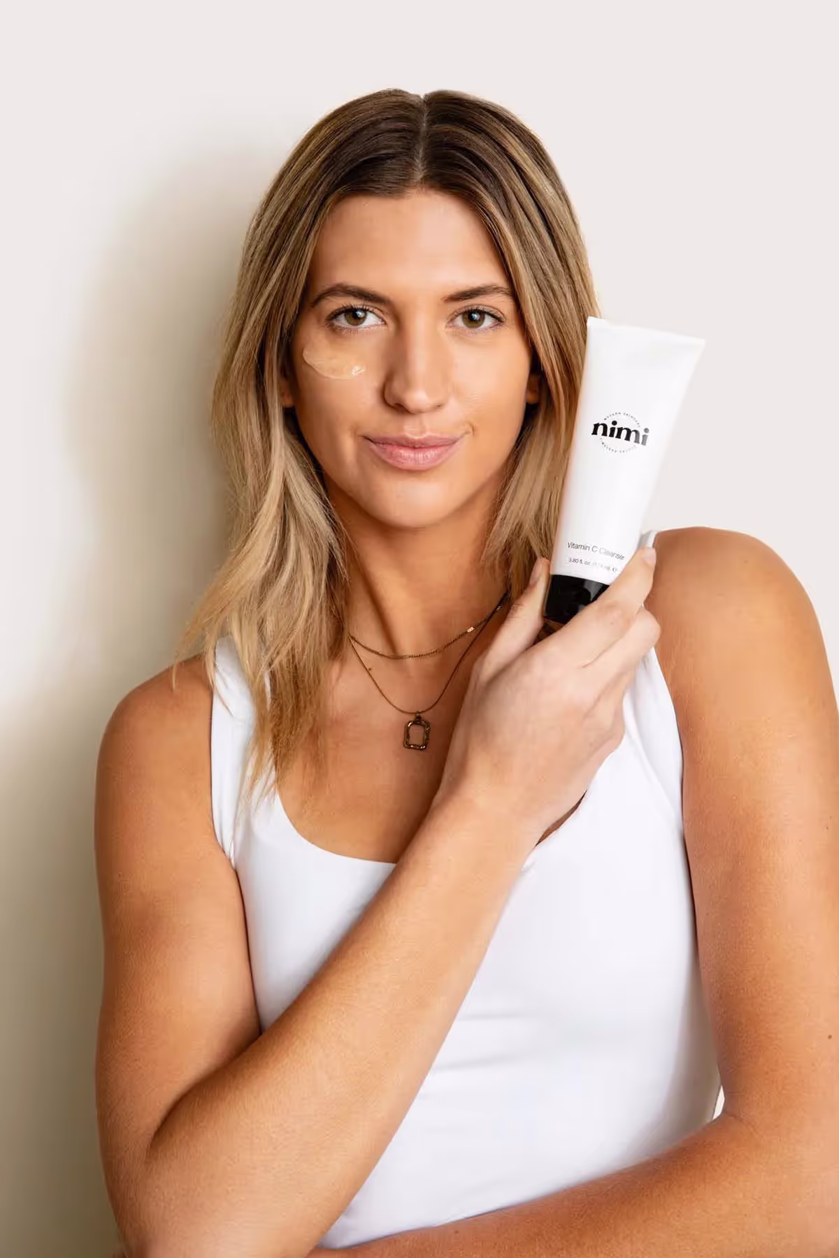 a woman using face cream